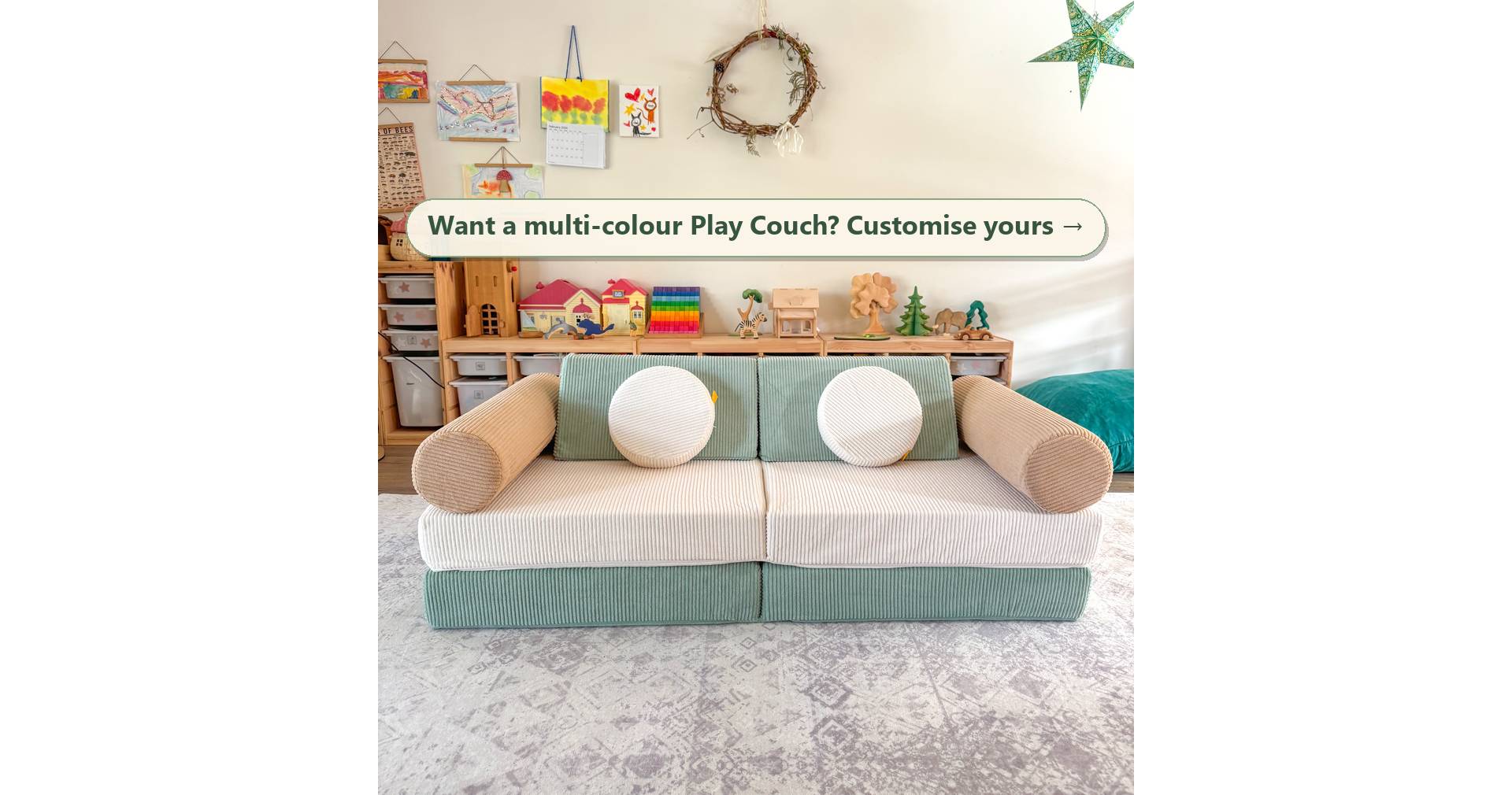 Sage green and snow white Funsquare Play Couch with biscuit beige bolsters in a kids playroom