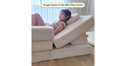 Snow white Funsquare Mini Play Couch with child lounging back on the cushioned wedge