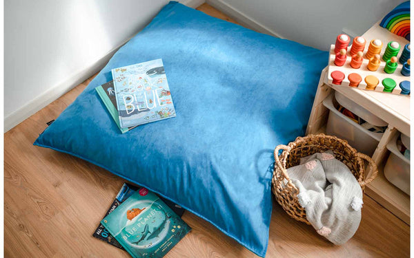 Blue microsuede Funsquare Crash Pad on a playroom floor